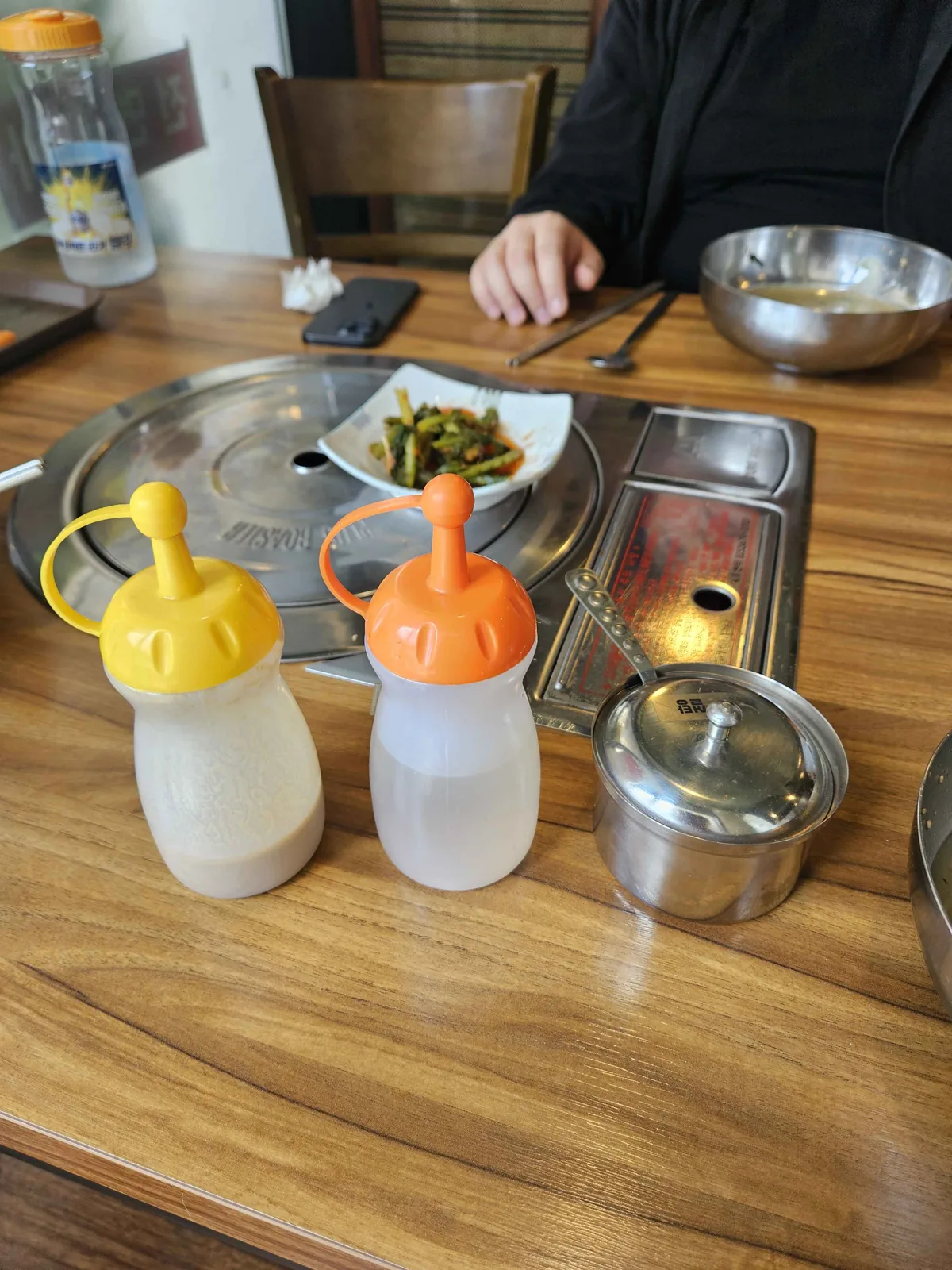 Mustard and vinegar condiments served with mul makguksu