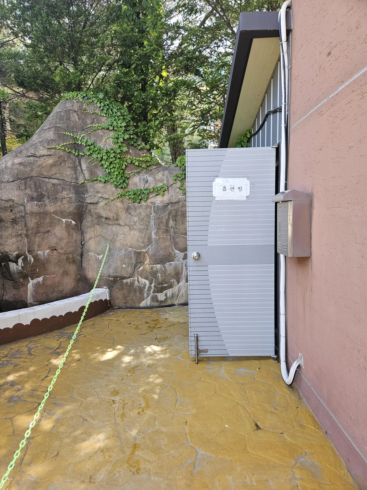 The outdoor smoking spot itself, tucked behind the building