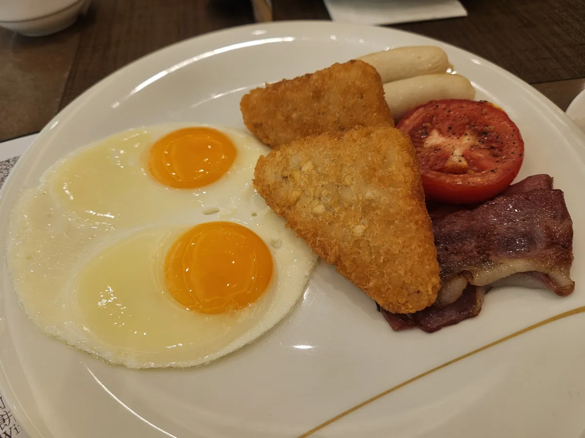 Number 1 — fried eggs, hash brown, bacon, tomato