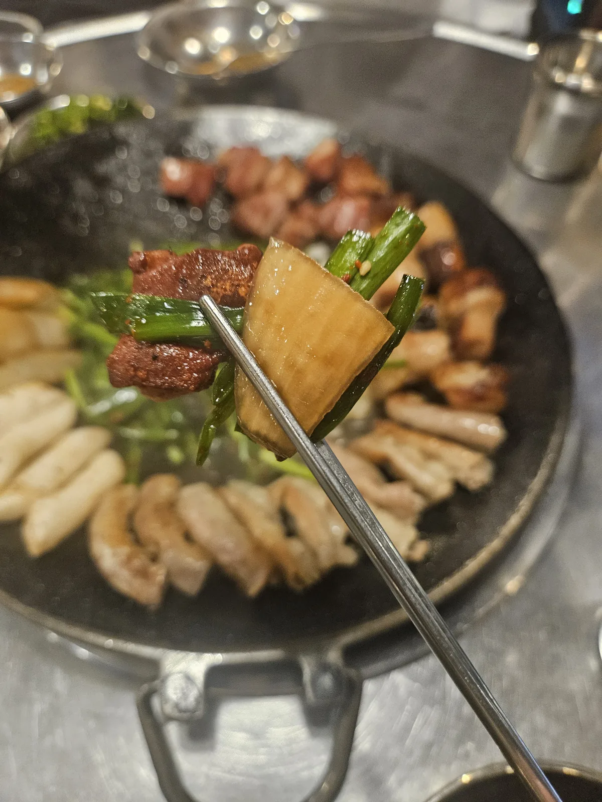 The mixed platter, grilled and ready, with garlic chives piled on top