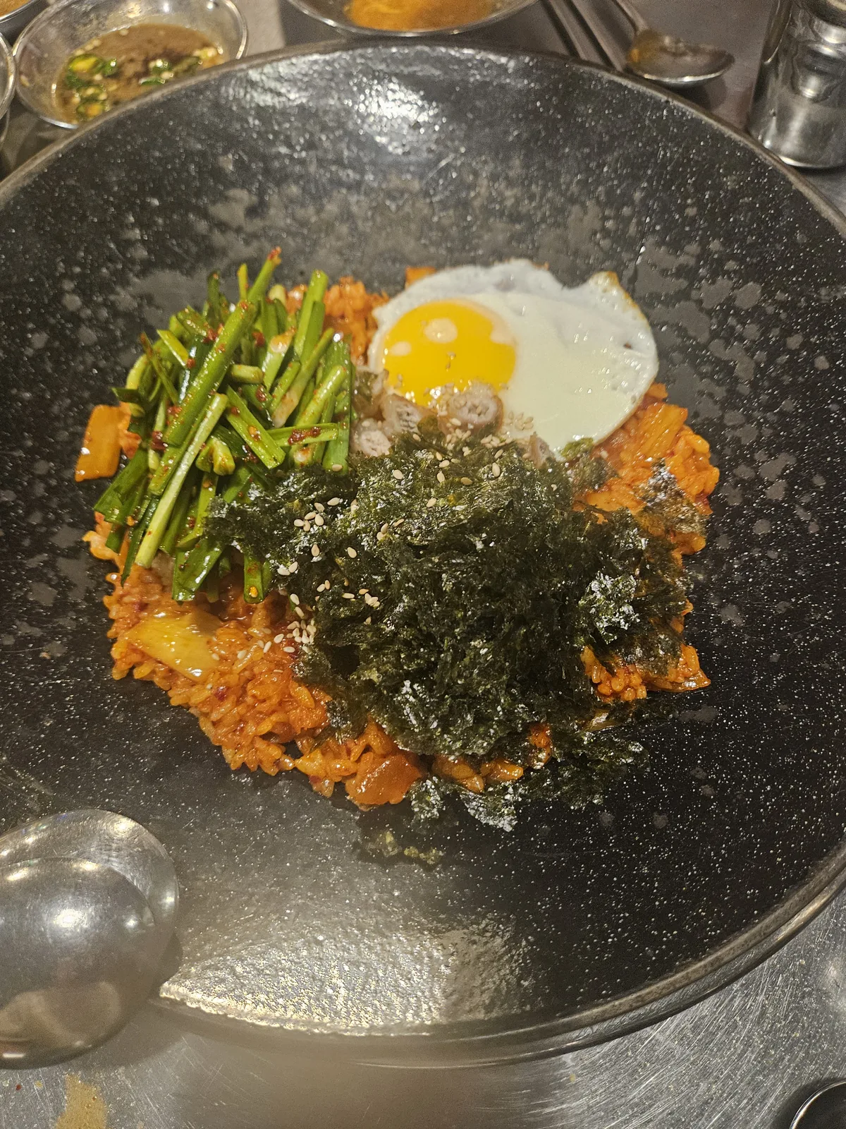 The fried rice going into the pan the offal came out of