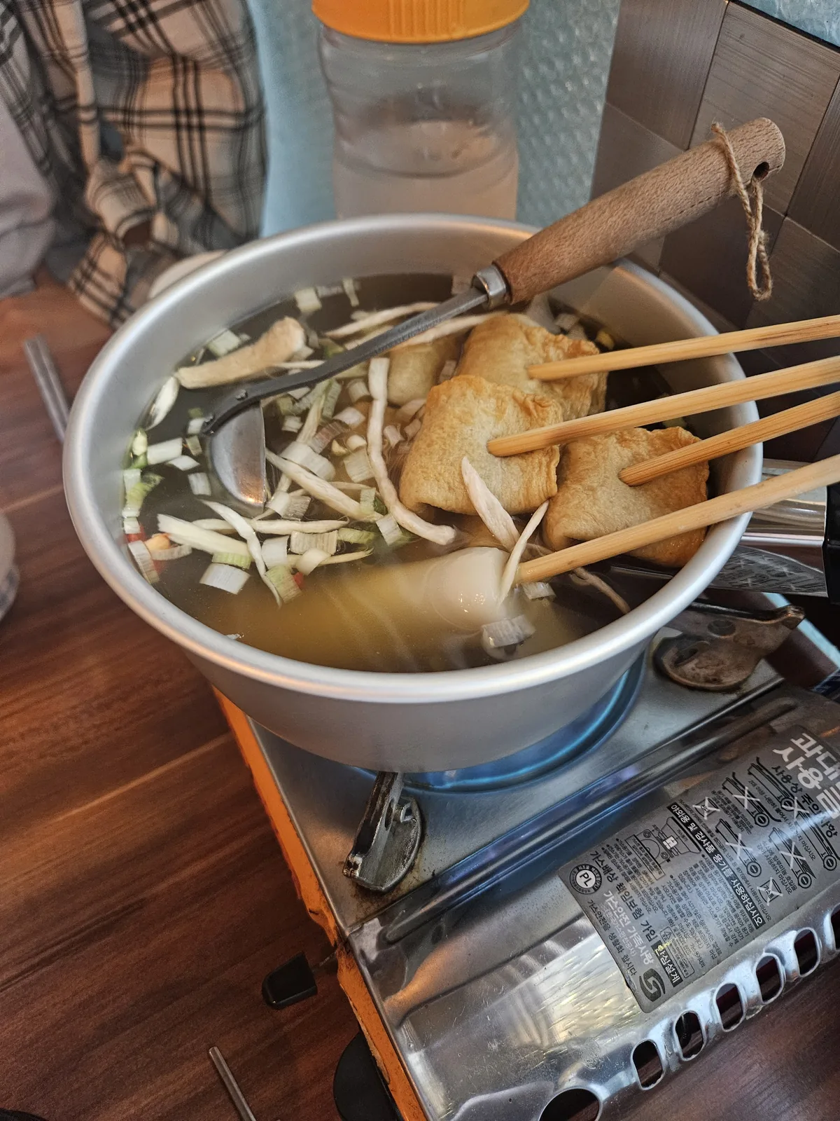 Curly fishcake skewers and mul-tteok rice cake in broth