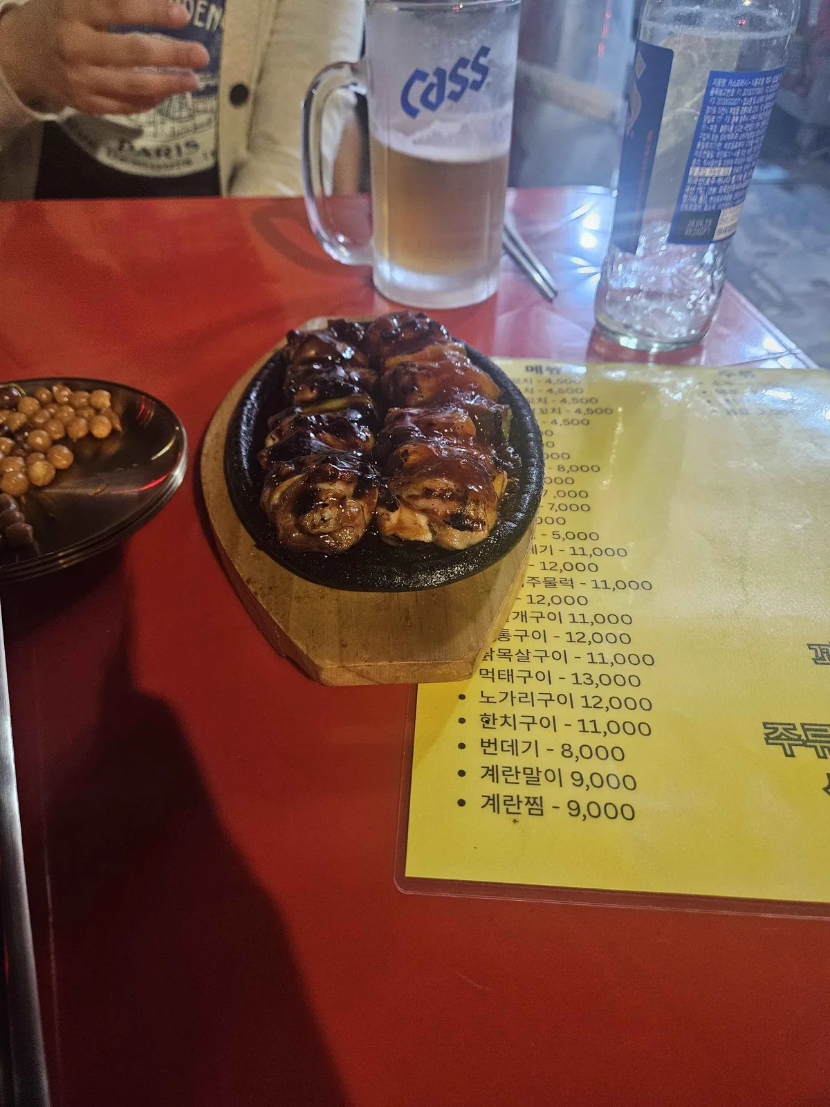 Chicken skewers on the grill at Apgujeong Dakgochi